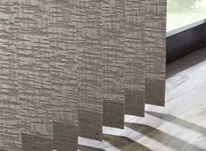 Close-up of textured grey fabric vertical blind slats