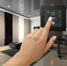 Finger pressing a wall control panel for motorized window coverings