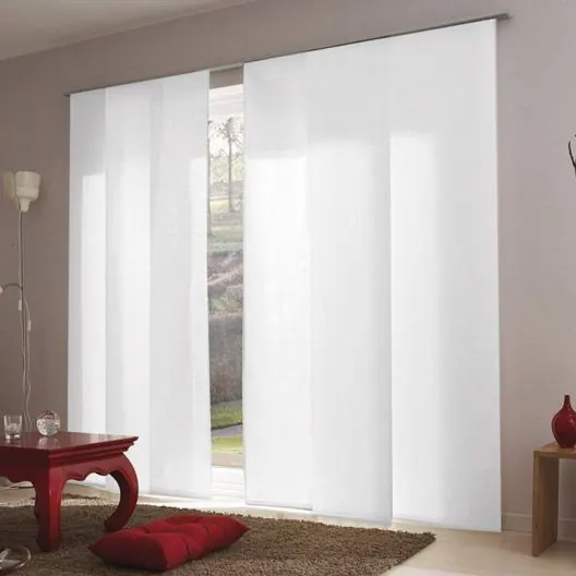 White sliding panels at a glass door with a red low table and cushion